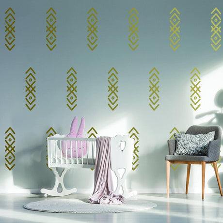 WhimsyArrows vinyl wall decals in a nursery, featuring playful patterns and a cozy crib with plush bunny pillow.