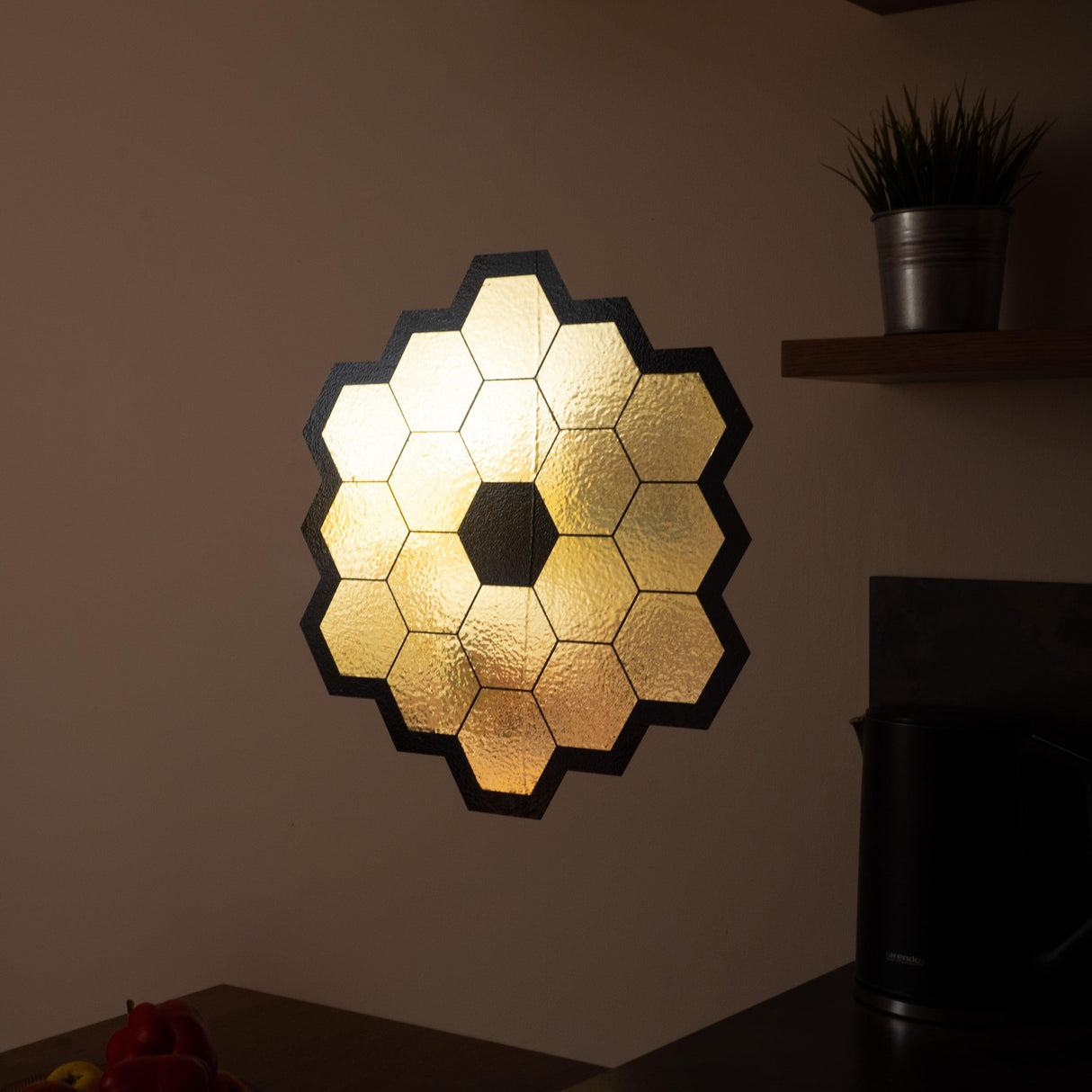 Gold chrome vinyl wall sticker of James Webb Space Telescope mirrors for space-themed decor.