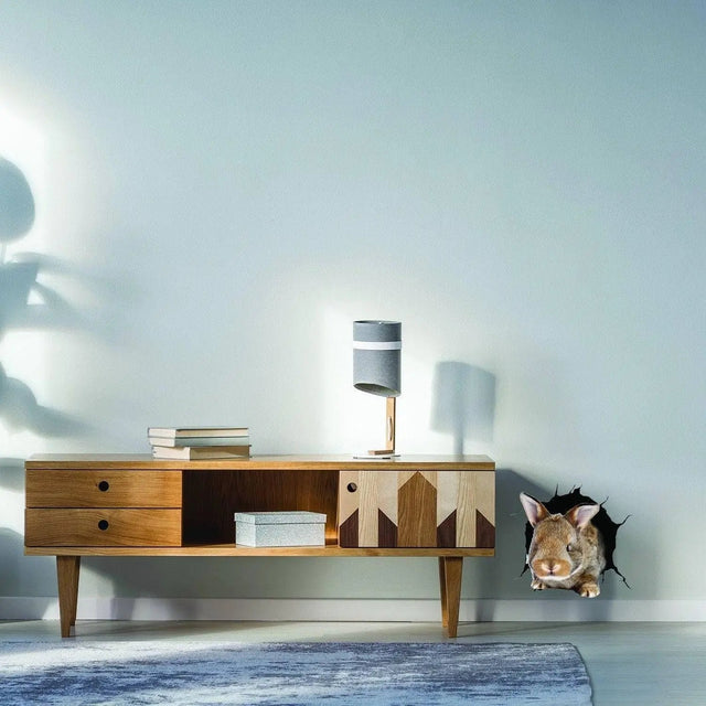 3D rabbit wall sticker design peeking through a wall, adding whimsy to kids room decor.