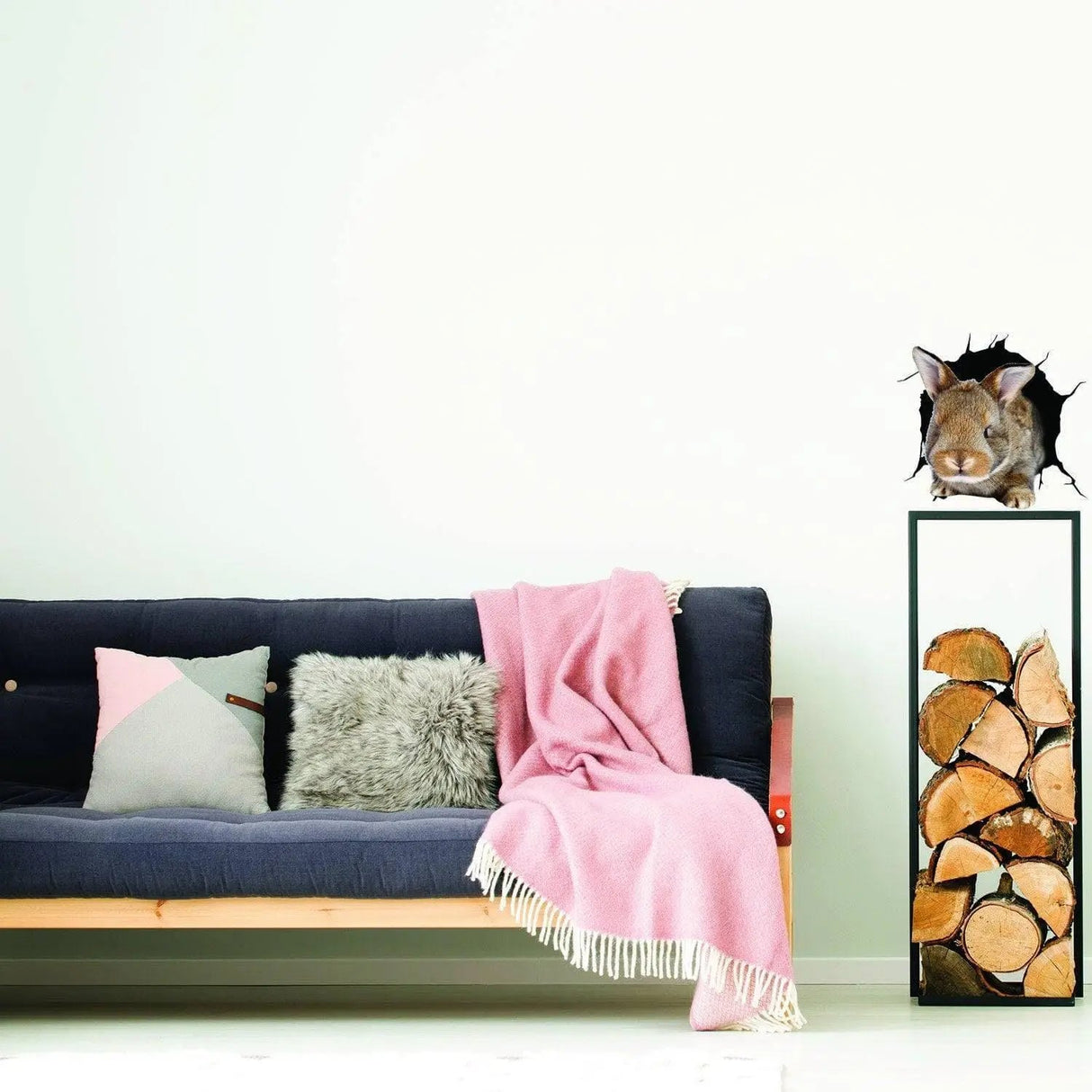 3D rabbit wall sticker above modern sofa with pink throw, adding a whimsical touch to the stylish living room decor.