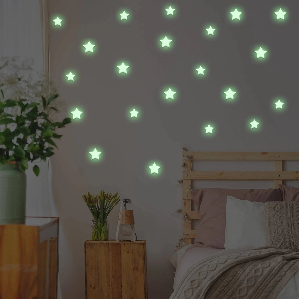 Glow in the dark star stickers on a bedroom wall, creating a magical starry atmosphere.