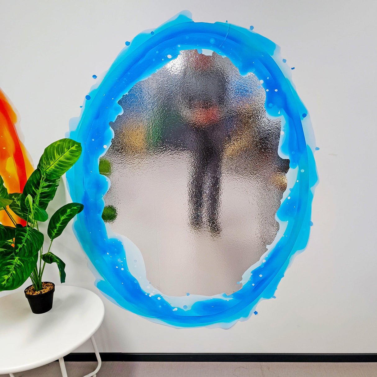 Blue and orange portal aura wall sticker on a wall, creating a vibrant decorative effect.
