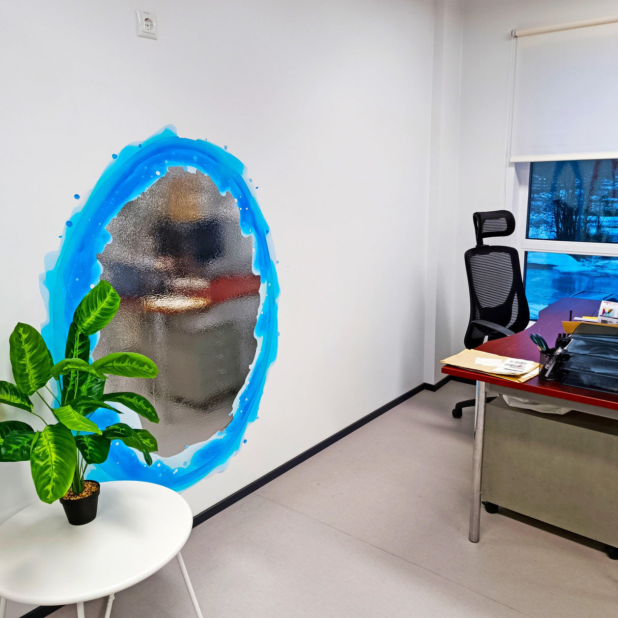 Blue portal aura wall sticker in an office, creating a vibrant decor accent with a plant and desk.