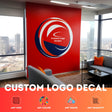 Custom vinyl wall sticker showcasing a business logo in a stylish office setting.
