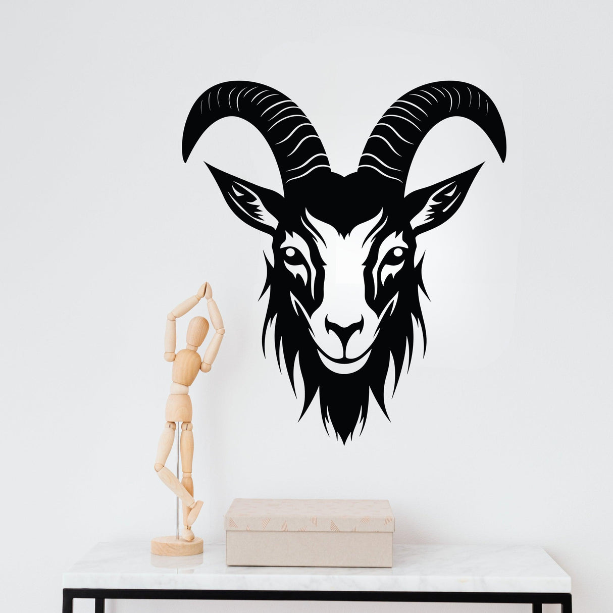 Bold black goat head silhouette wall sticker adding a striking touch to modern interior decor.