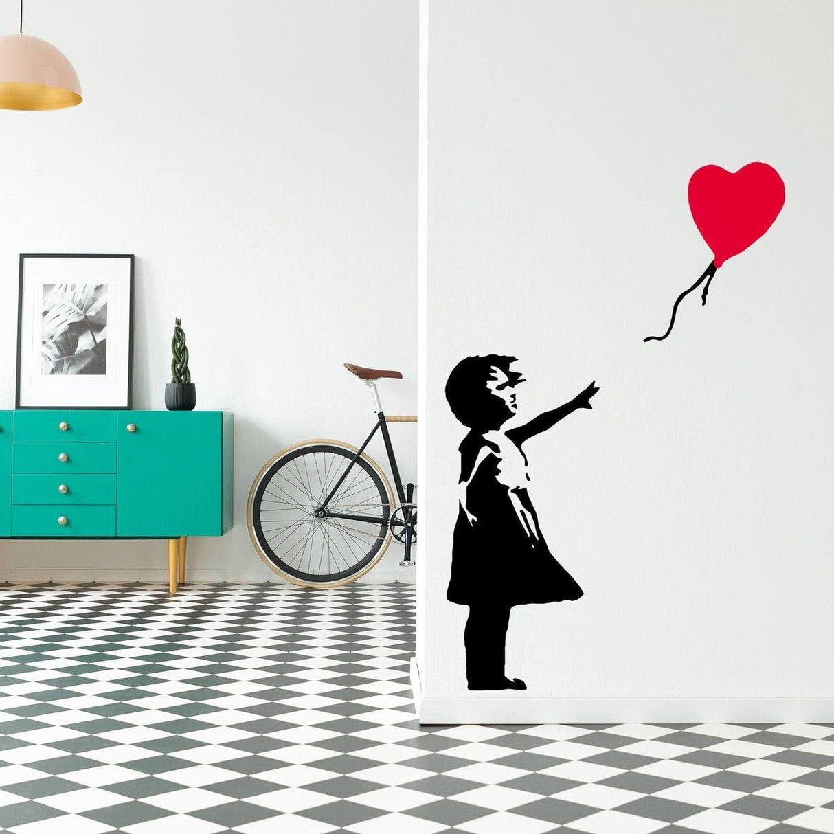 Vinyl wall decal of a girl with a heart balloon, adding whimsical charm to modern room decor.