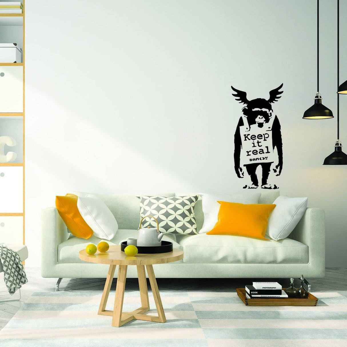 Banksy-inspired monkey wall sticker with 'Keep it real' text in modern living room decor