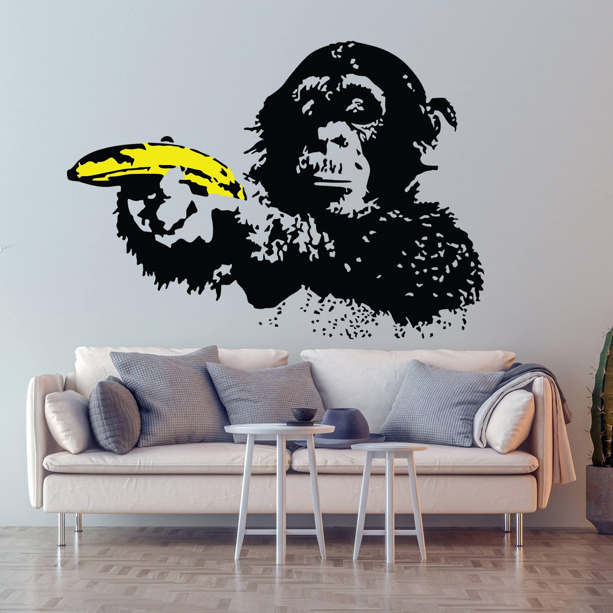 Vibrant street art chimp wall decal featuring a monkey holding a banana, bringing personality to modern decor.