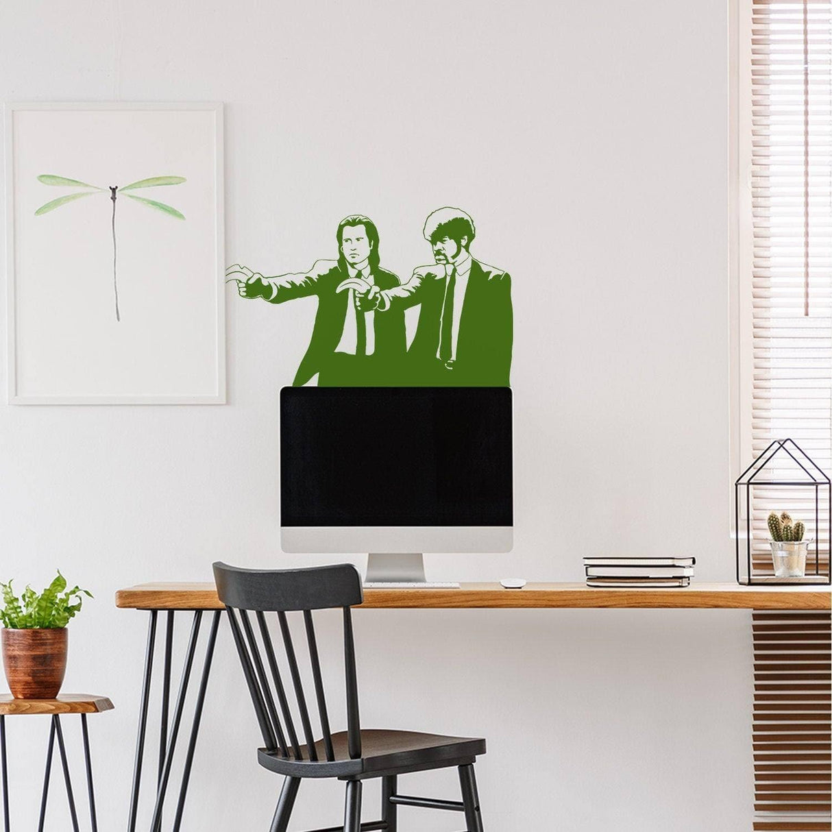Banksy Pulp Fiction wall art sticker featuring two iconic characters in green, enhancing a modern workspace decor.