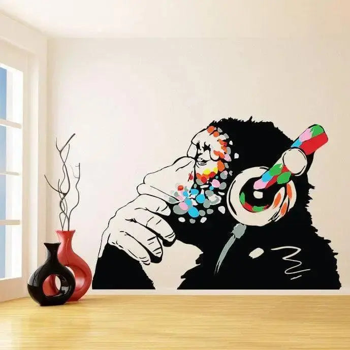 Banksy-inspired thinking monkey wall sticker, colorful chimp with headphones, modern art decal for interiors.