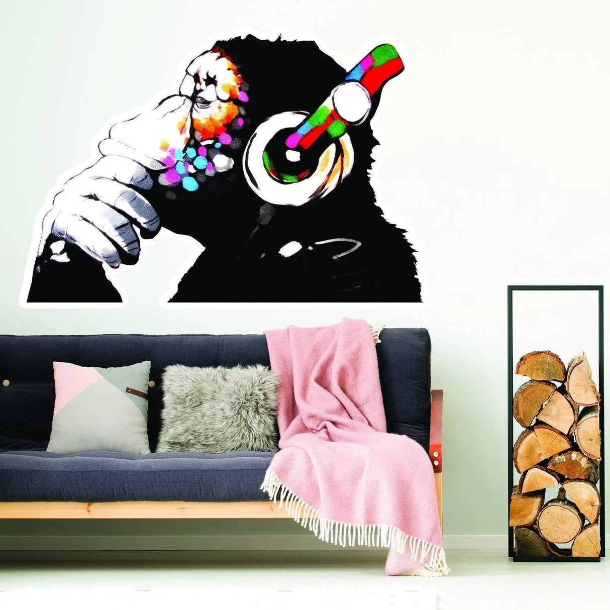 Contemplative monkey wall sticker with headphones in modern living room setting, colorful vinyl decal for home decor.