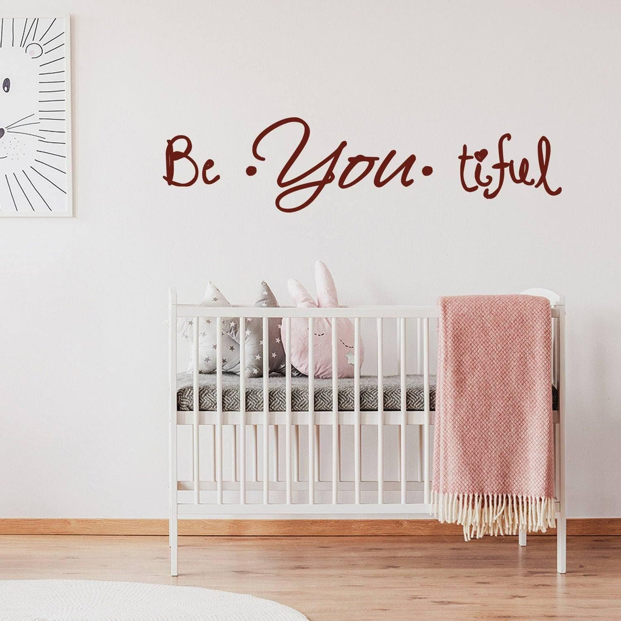 Inspirational 'Be You tiful' wall decal above crib, perfect for nursery decor and motivational ambiance.