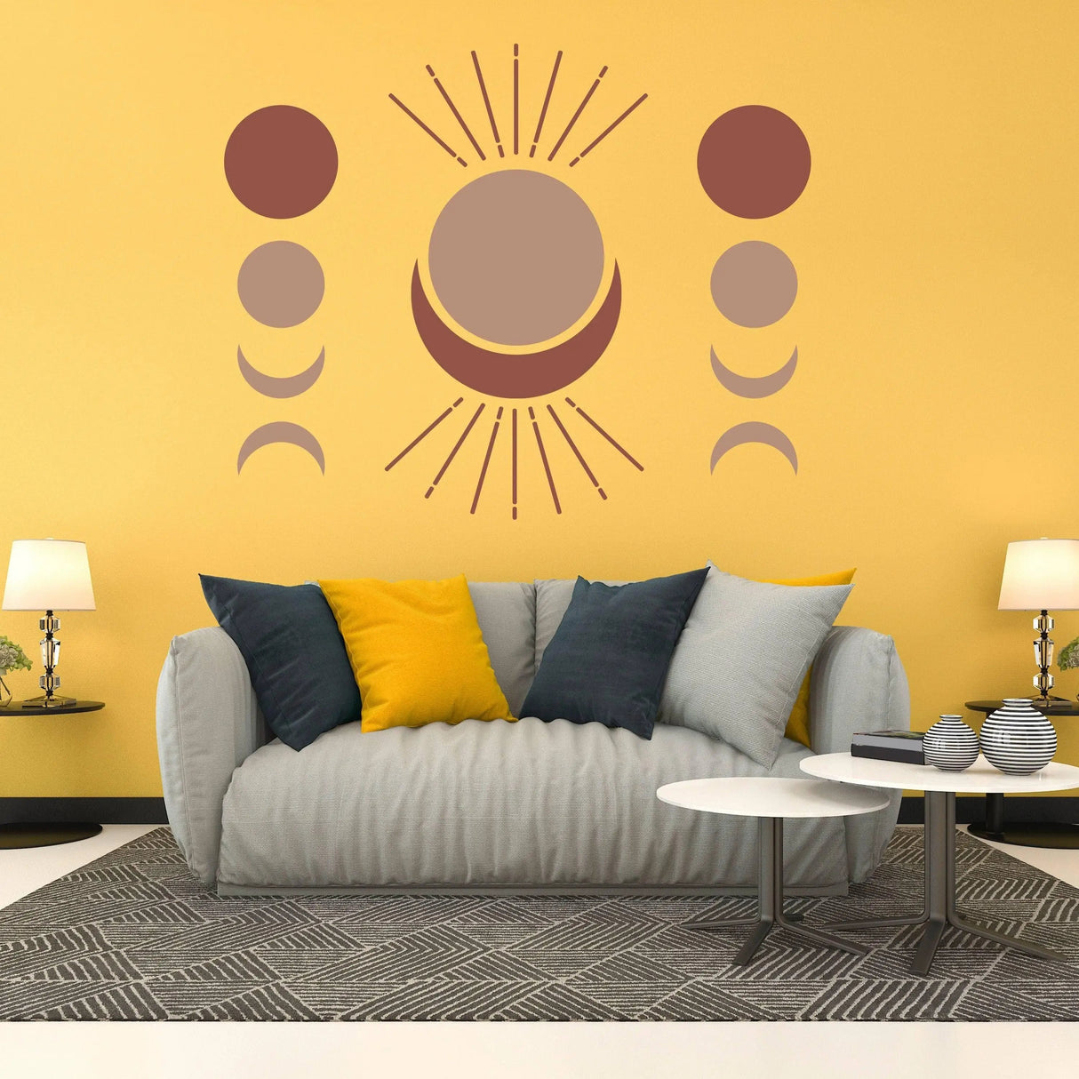 Bohemian crescent and moon phases vinyl wall art sticker decal on yellow wall above grey couch.