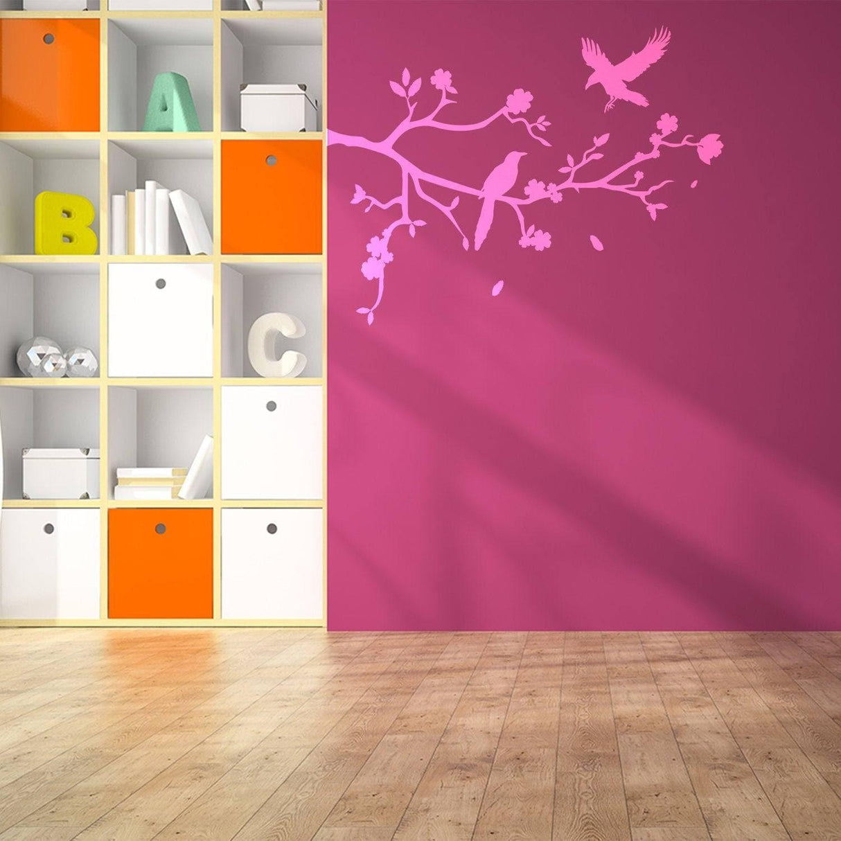 Chic tree branch wall decal in pink on a vibrant wall, enhancing modern room decor with birds and flowers.