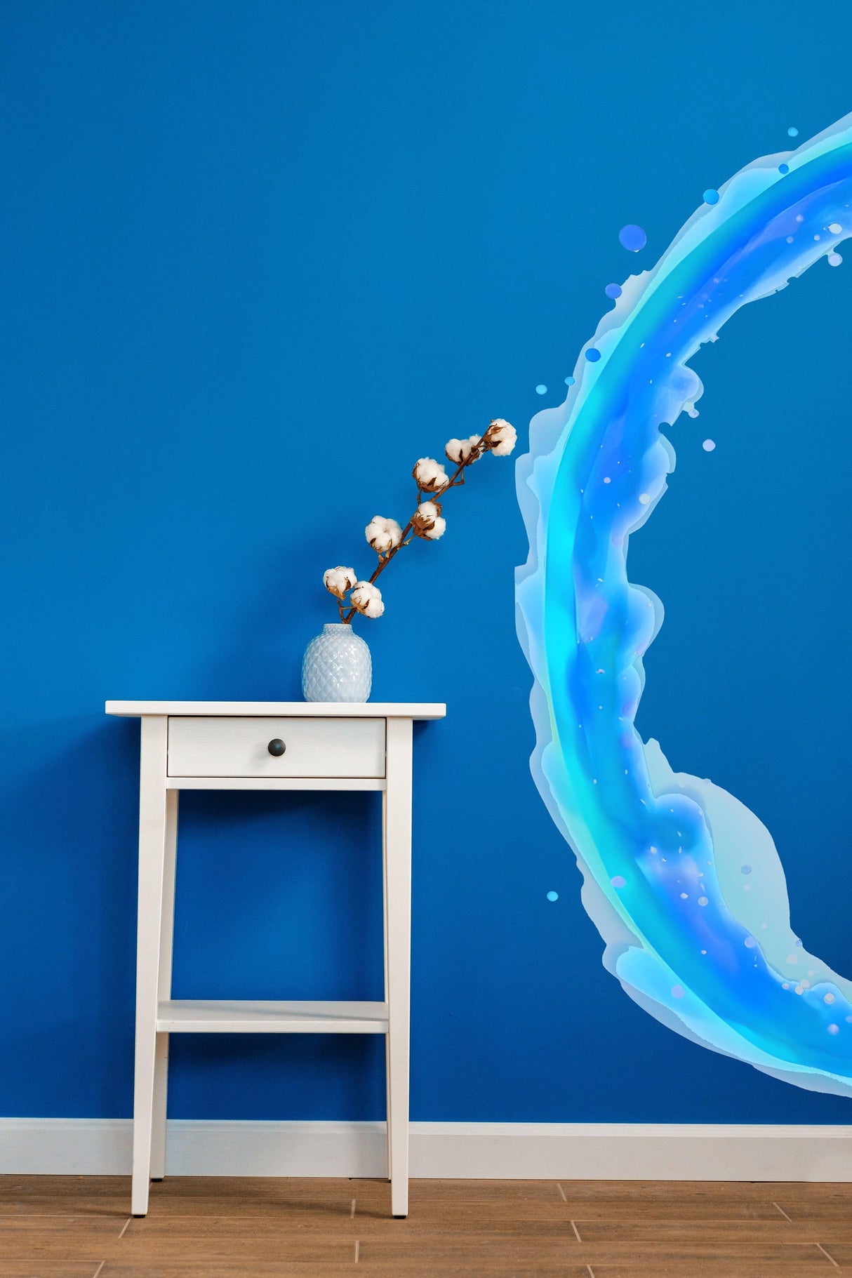 Vibrant blue portal wall sticker beside a white side table with decorative vase and flowers, enhancing room decor.