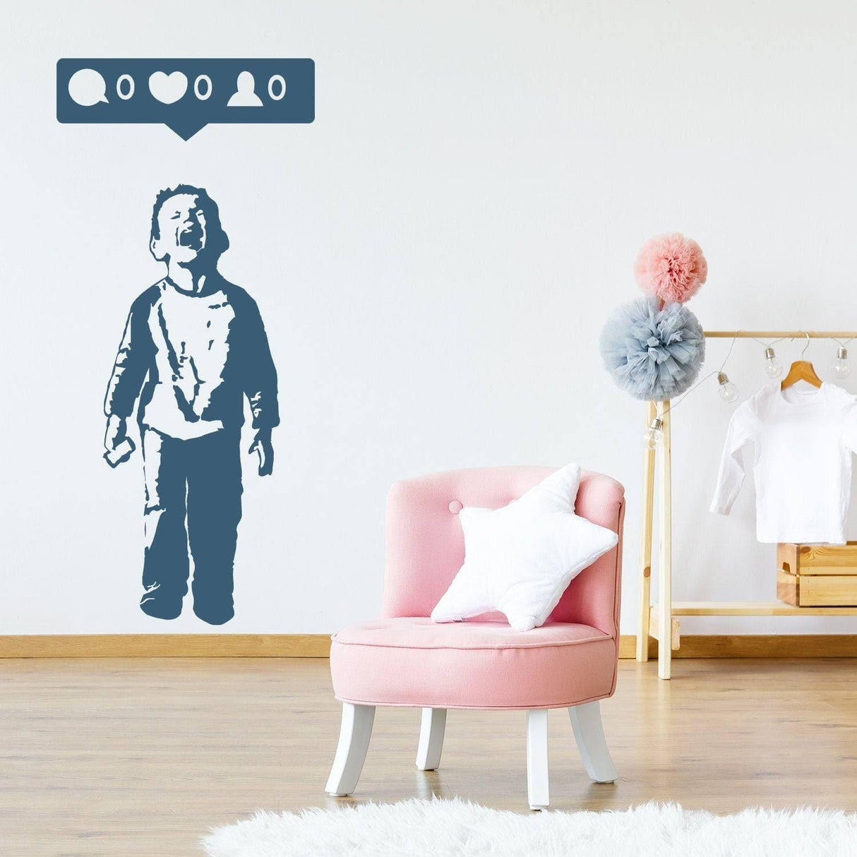 Urban street art mural featuring a boy with a cellphone on a wall above a pink chair in a trendy room.