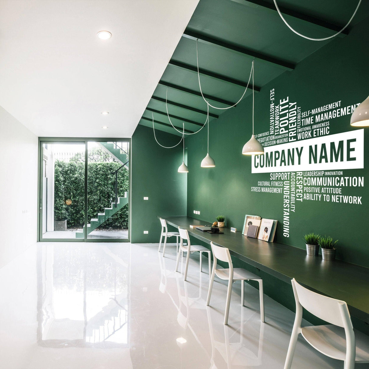 Custom office wall decal featuring personalized business name on green wall in modern workspace design.