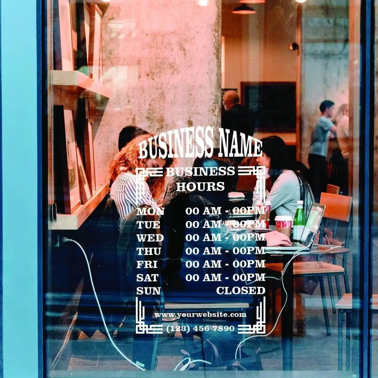 Personalized vinyl business hours decal displayed in a shop window with detailed schedule and contact information.