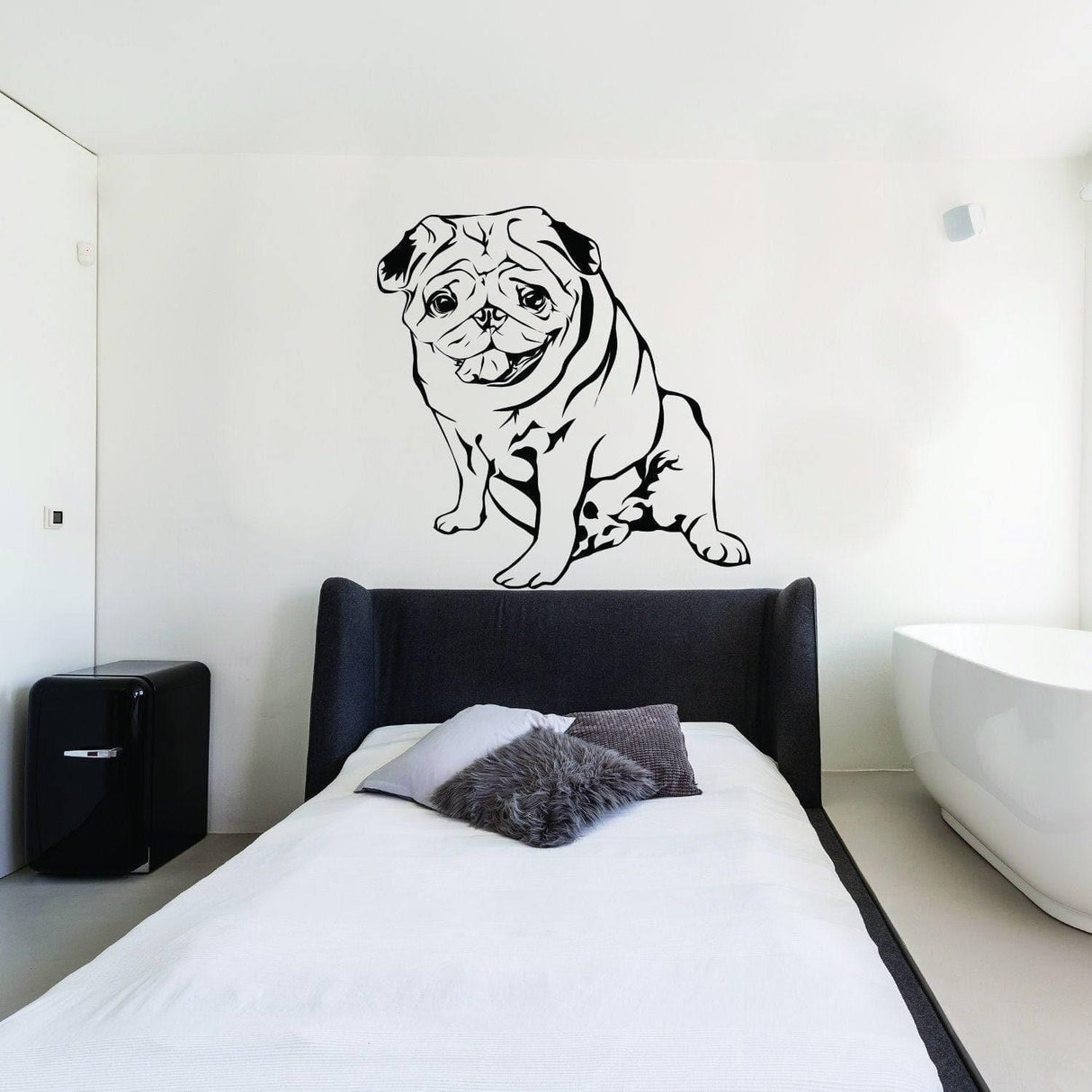 Custom wall decal of a pug sitting on a white wall above a bed, showcasing a personalized pet portrait.