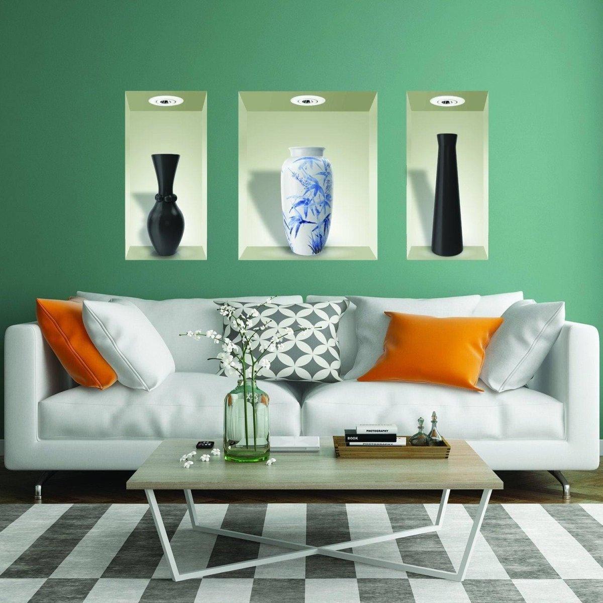 Elegant 3D floral wall decals in black and blue vases above a modern white sofa with orange accents.