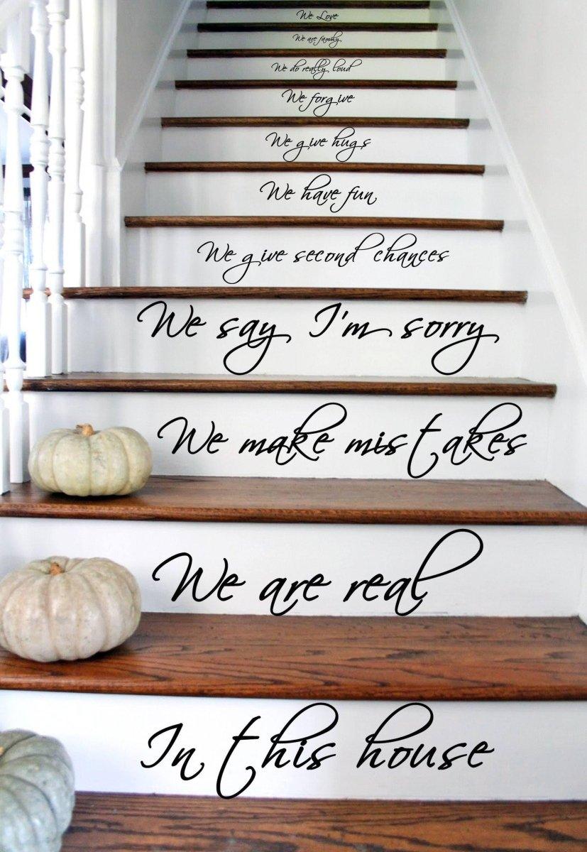 Stylish stair decals with quotes on wooden steps, enhancing home decor with elegant designs.