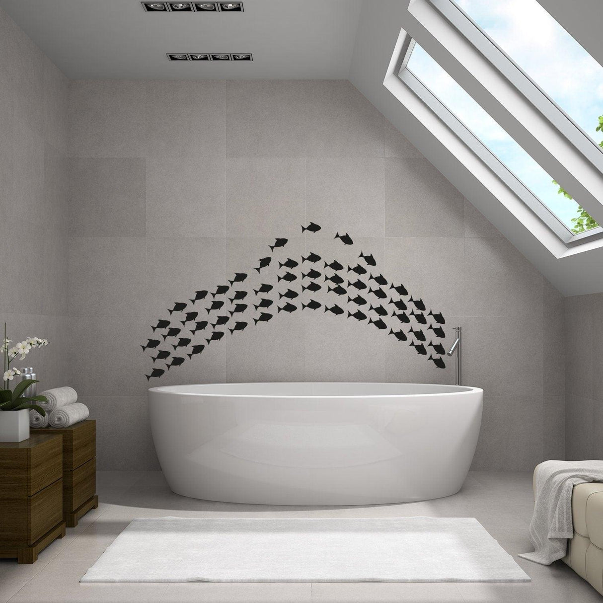 Underwater oasis wall decal set featuring black fish stickers above a modern bathtub in a stylish bathroom.