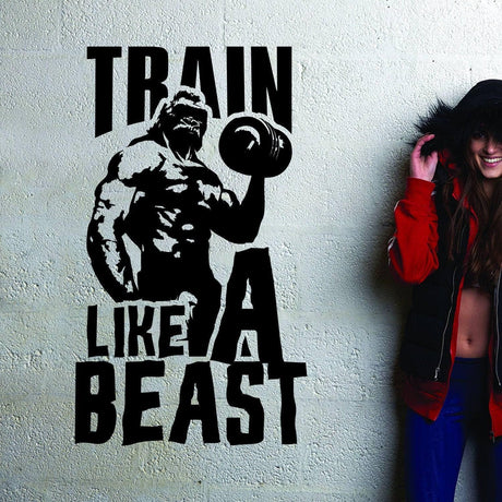 Inspirational 'Train Like a Beast' wall decal with a muscular figure, perfect for gym motivation and fitness decor.