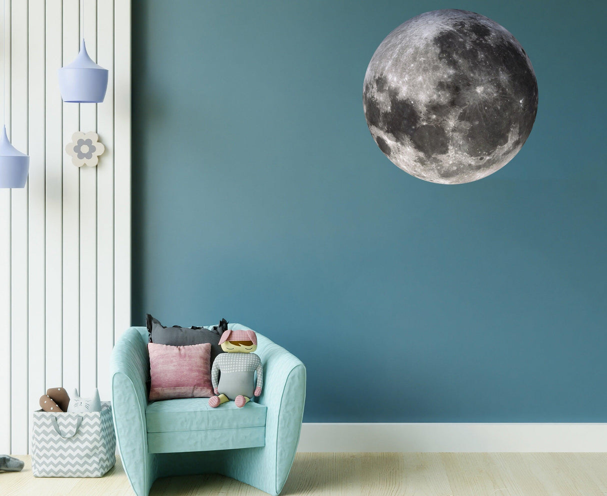 Large full moon wall sticker above a cozy chair in a kid's room, enhancing the celestial decor theme.