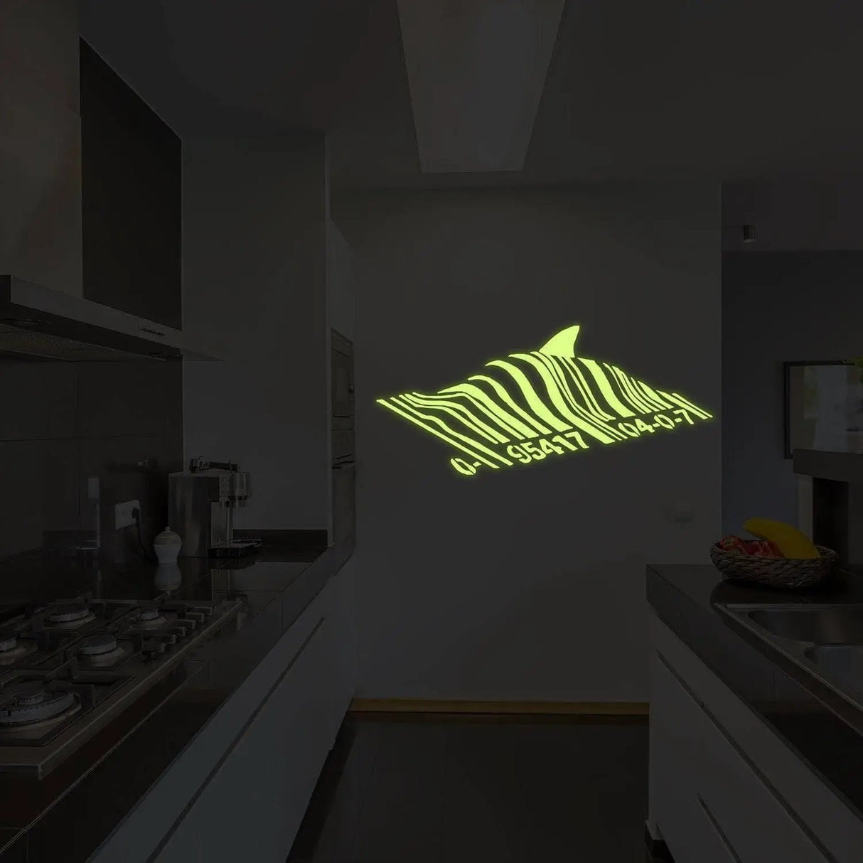 Glow in the dark shark wall decal casting a mesmerizing green light in a modern kitchen setting.