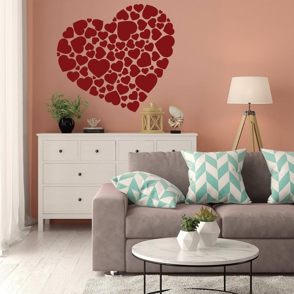 Red heart vinyl sticker wall art in cozy living room, adding a romantic touch to home decor.