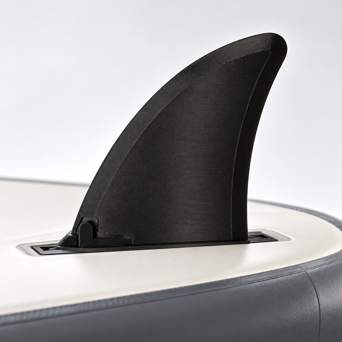 Illustrative view of a black Hydro Force compatible replacement fin mounted on an inverted SUP board