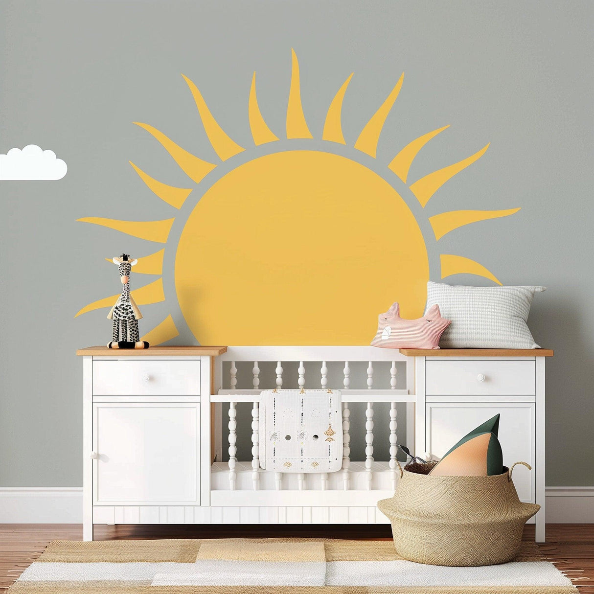 Large yellow half sun wall decal in a cheerful nursery with cloud decor and white furniture.