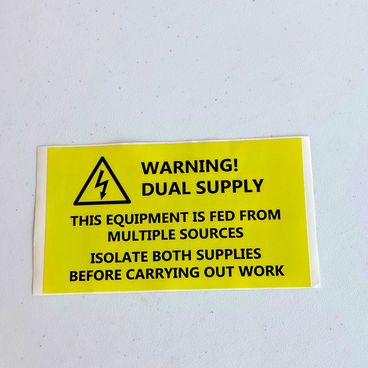 Dual Supply Warning Label Sticker with safety instructions for electricians on multiple source isolation.