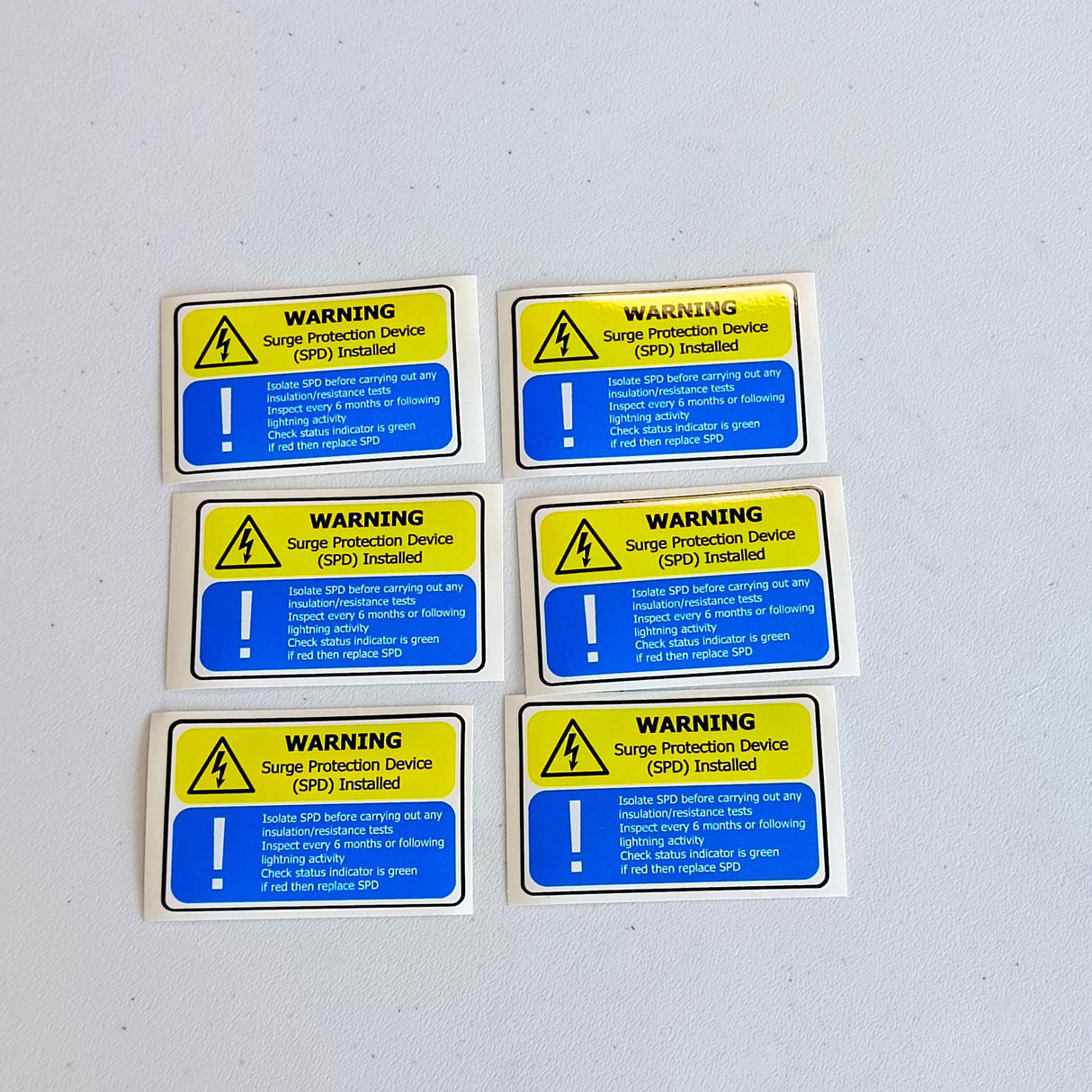 Set of 6 Surge Protection Device (SPD) warning labels, yellow and blue decals for electrical safety and compliance.
