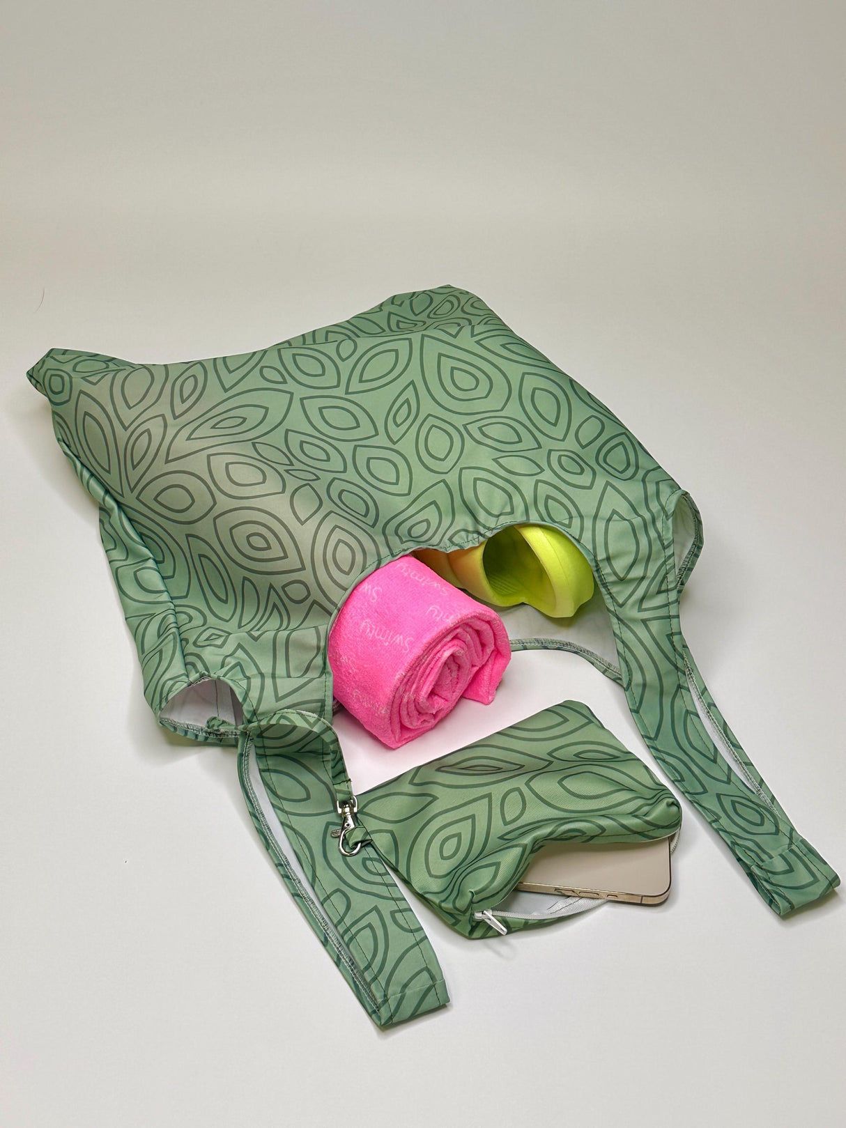 Women's XXL green leaves shopper bag with pink and yellow items inside, plus matching wallet.