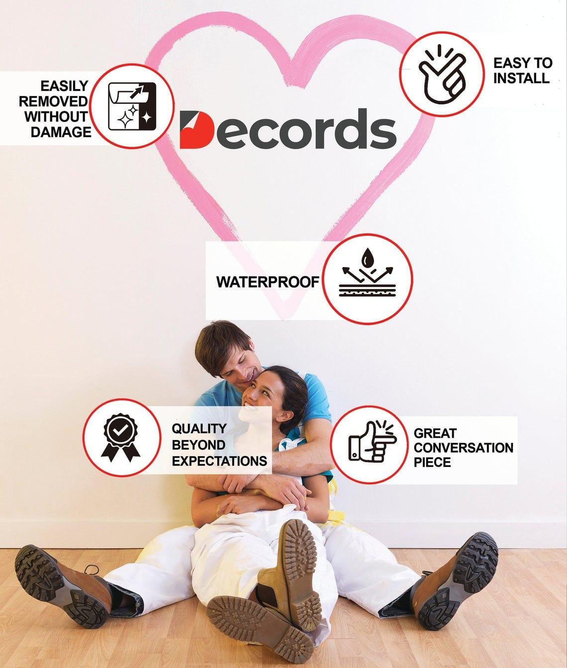 Couple sitting with wall decals highlighting features like waterproof and easy installation for decor.