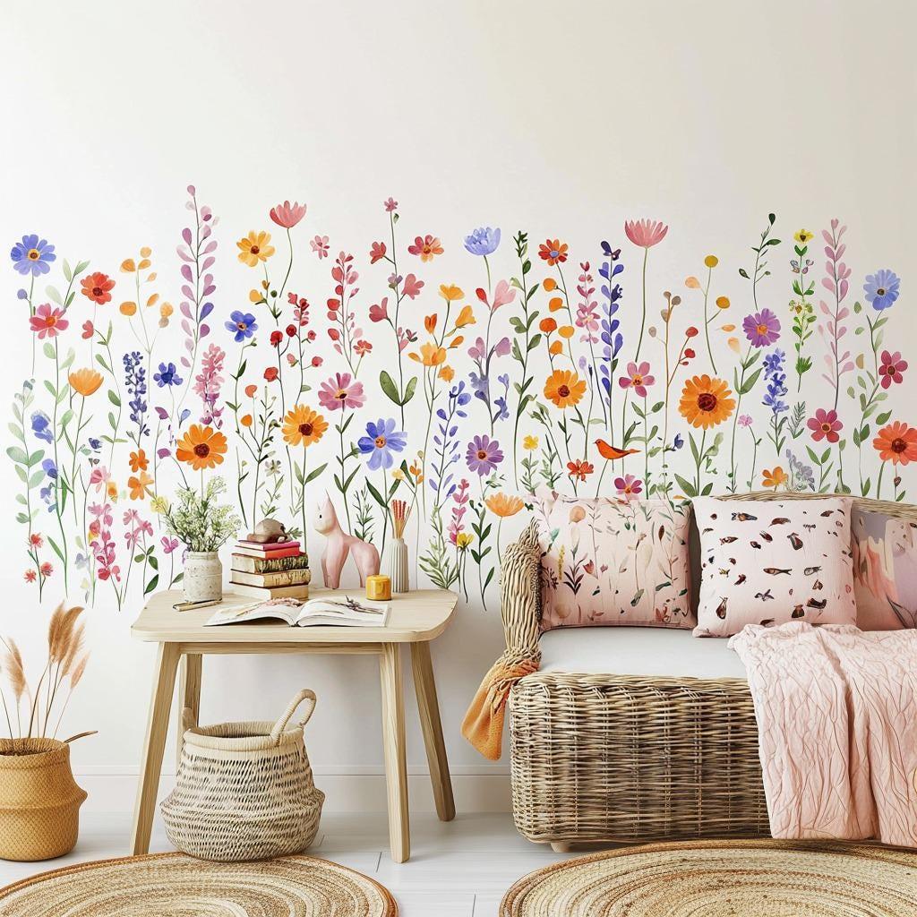Colorful wildflower wall decals decorating a room with a cozy sofa and cushions, creating a bright, cheerful atmosphere.
