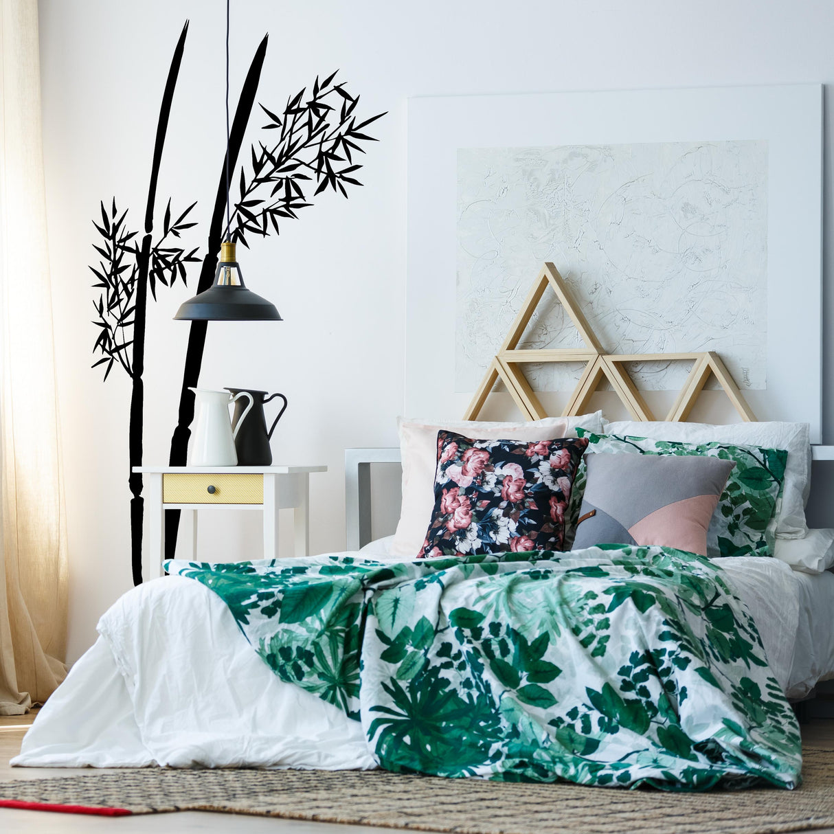 Bamboo wall decal in a modern bedroom with vibrant bedding and minimalist decor elements.