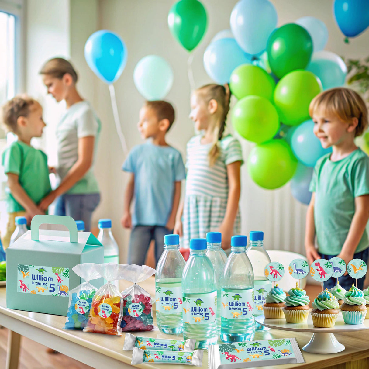 Dinosaur birthday party setup with personalized decals, snacks, and balloons for a child's celebration.