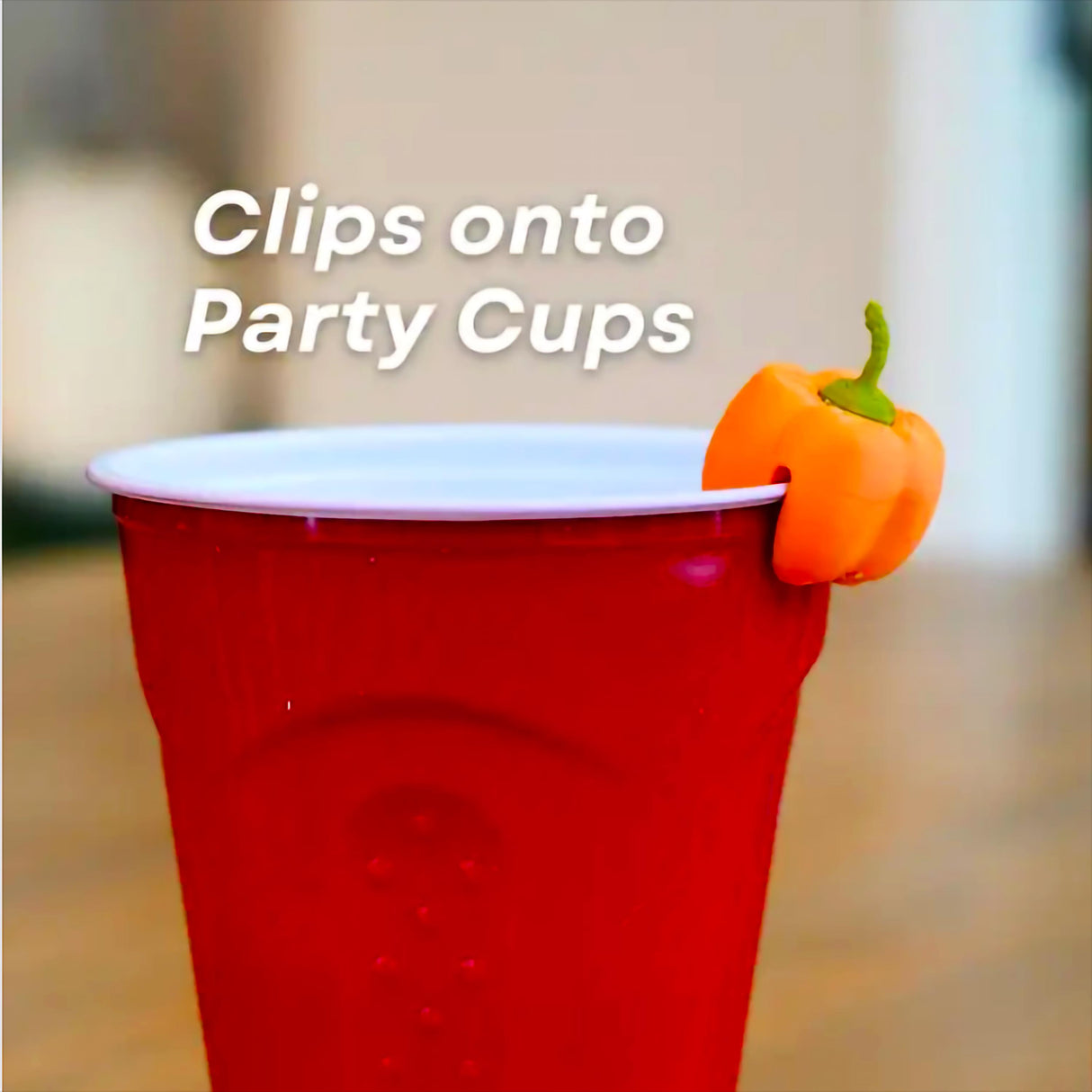 Fall-themed drink marker clips onto a red party cup, displaying a cute mini pumpkin design.