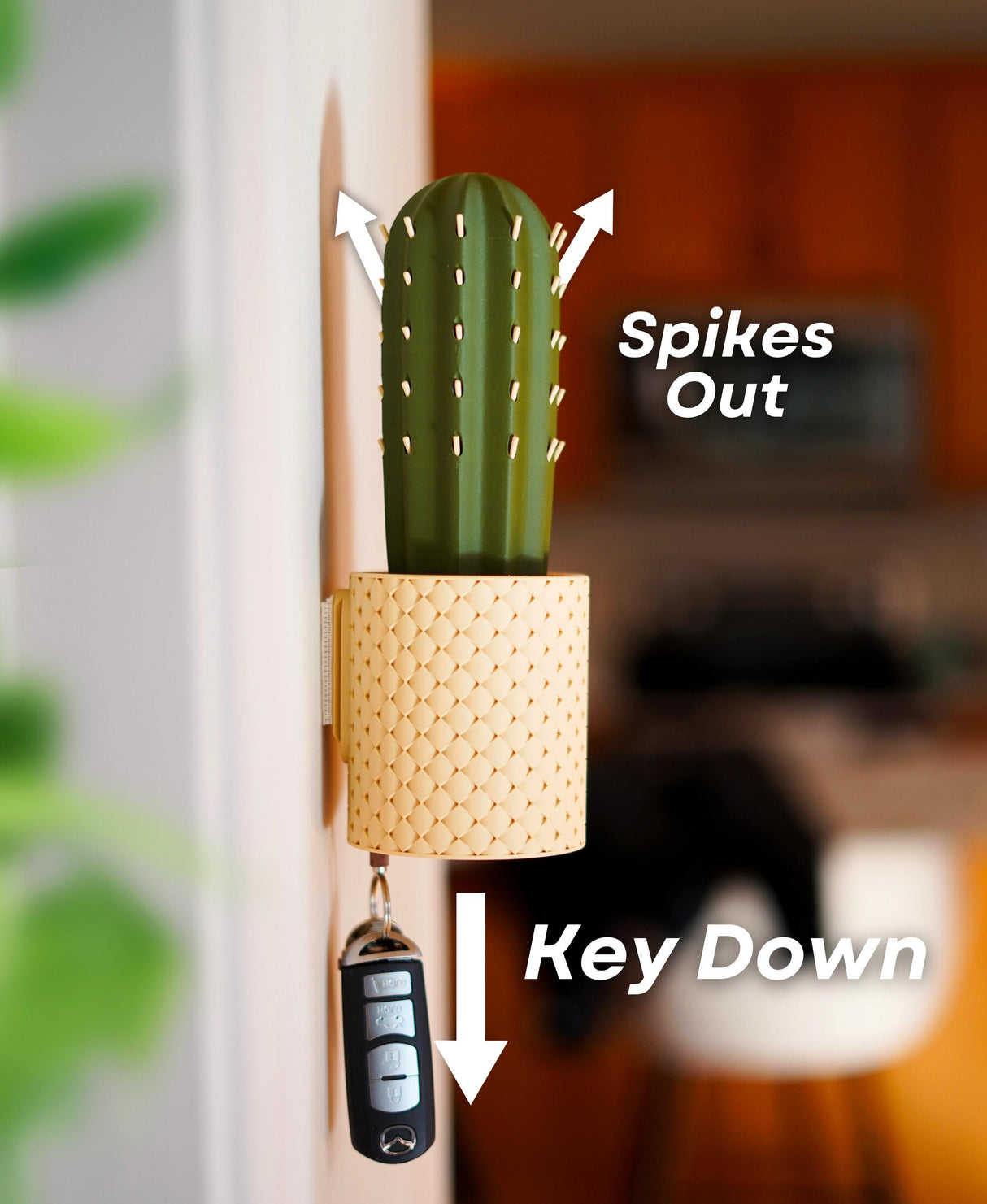 SpiKey Cactus Key Holder wall-mounted design with spikes extending, showcasing interactive key storage in modern setting.