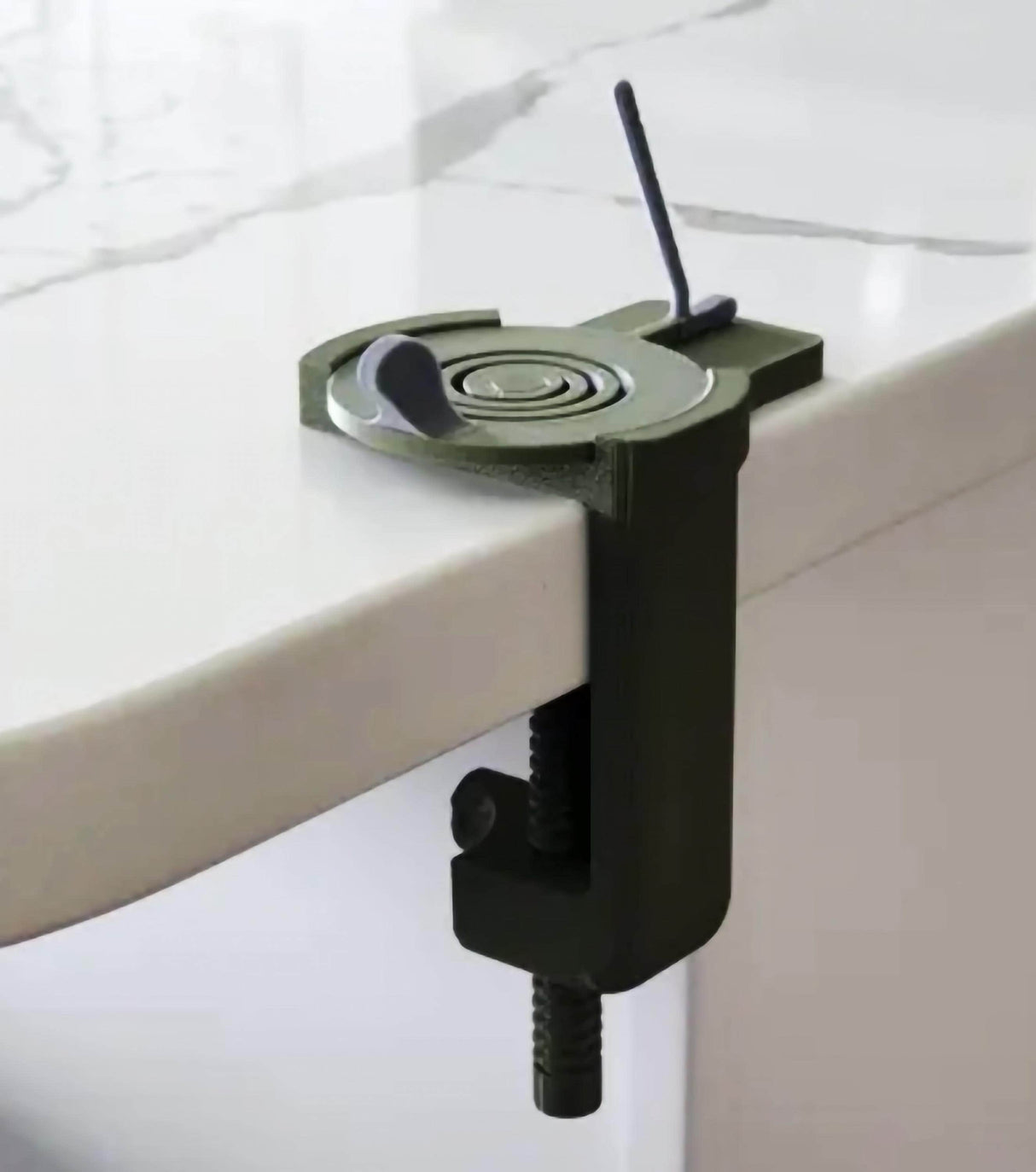 Compact clamp for securing objects to a table, ideal for creating your own desk golf game or other desk activities.