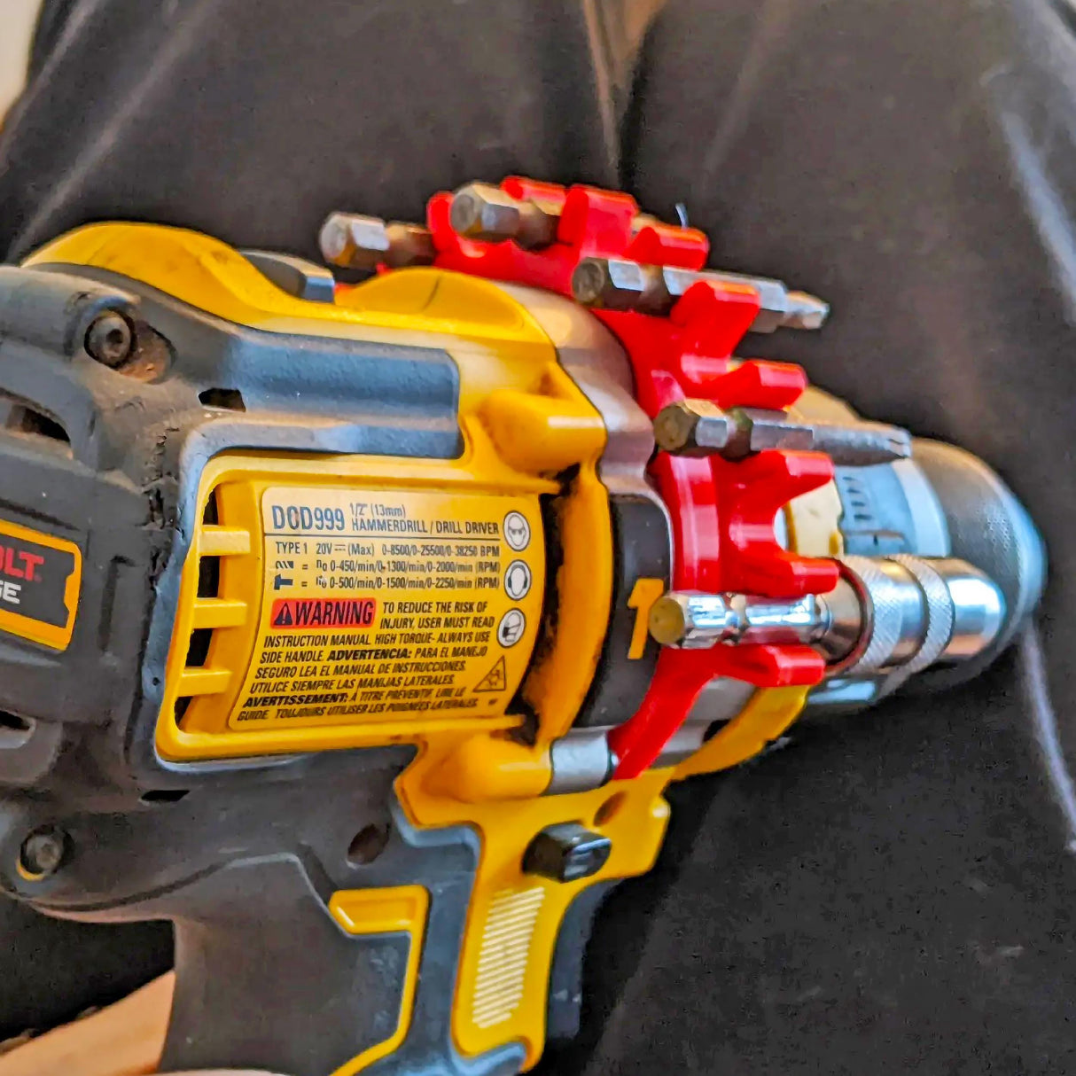 3D-printed drill bit holder clip attached to a power drill for organized storage and easy access.