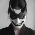 3D printed Oni mask worn by a person, featuring fierce design inspired by Japanese folklore and samurai culture.