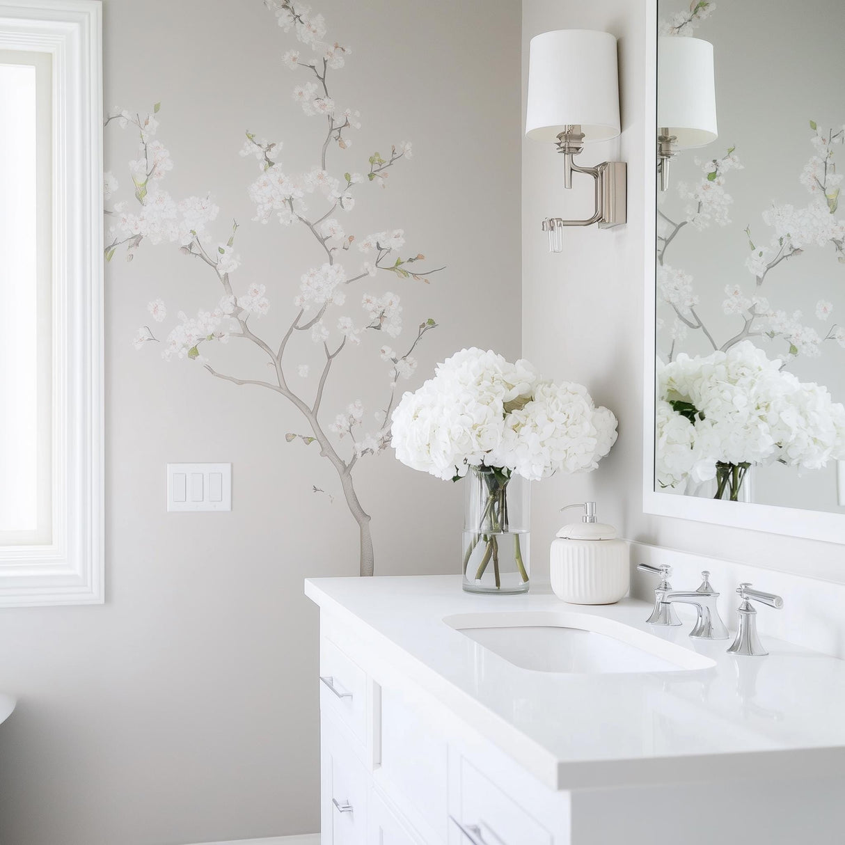 Elegant Chinoiserie blossom wall decal in light gray bathroom with a white vanity and fresh flowers.
