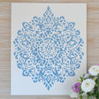 Intricate blue mandala stencil against a white background, perfect for DIY home decor, painting, and scrapbooking.