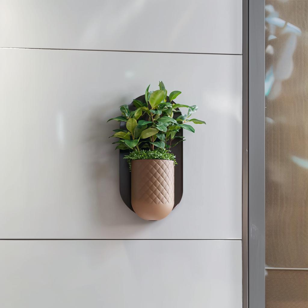 Modern minimalist wall planter with textured geometric design, featuring greenery in a sleek mounted planter.