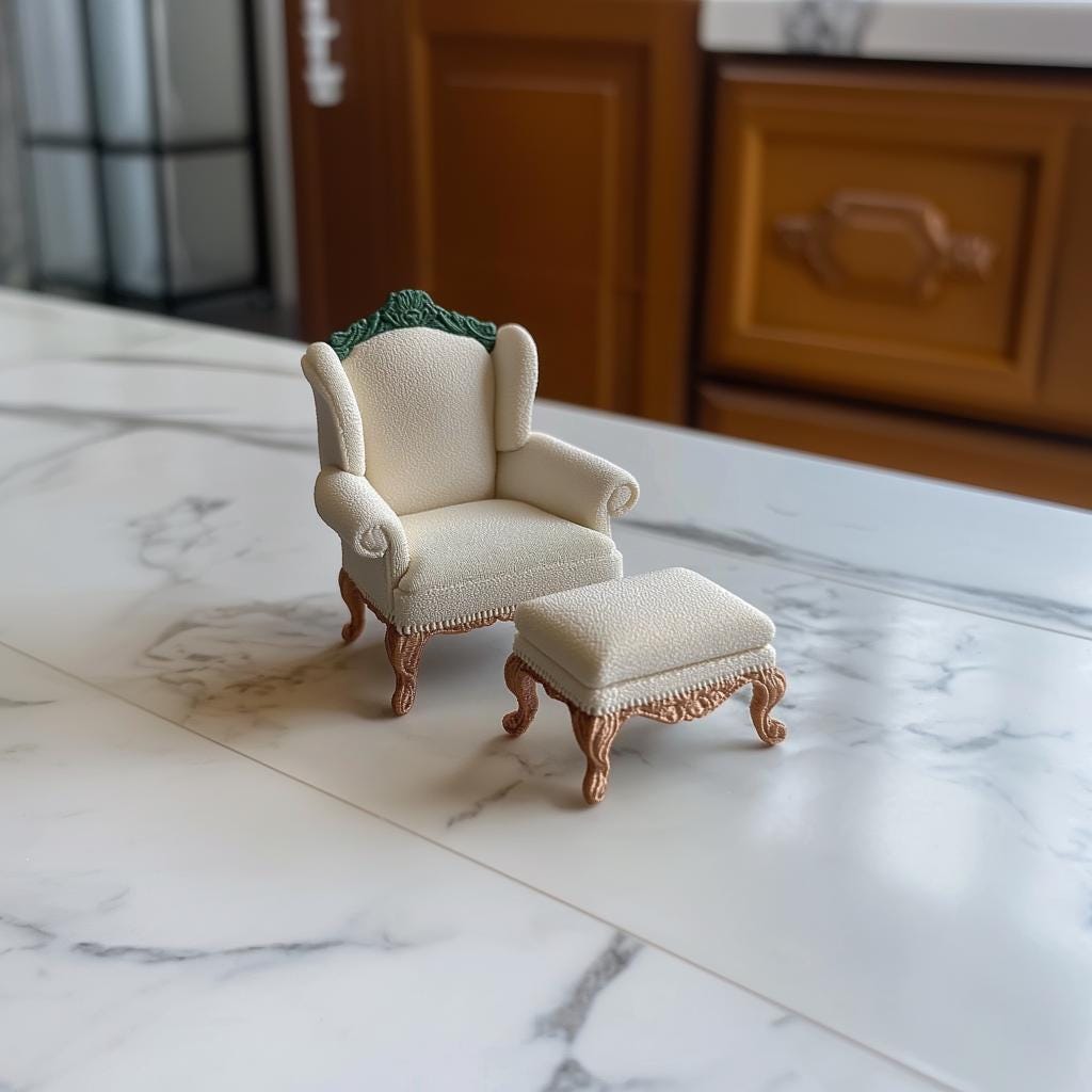 Victorian armchair and ottoman set in 1:12 scale, elegantly designed for dollhouse decor on marble surface.
