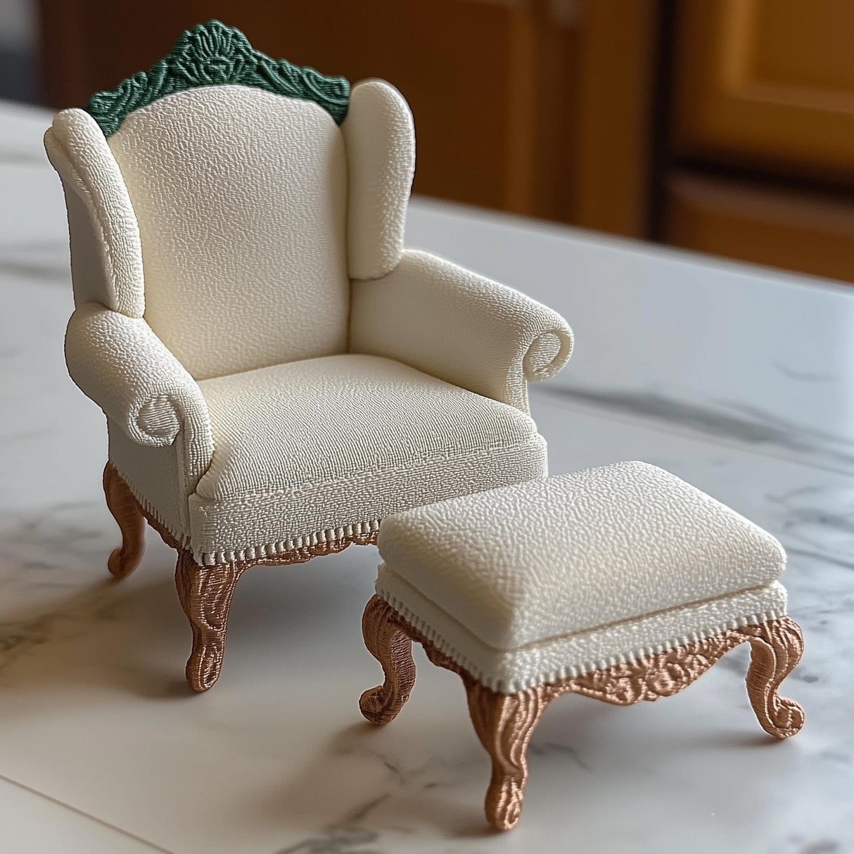 1:12 scale Victorian armchair and ottoman set with intricate carvings, perfect for dollhouse decor.
