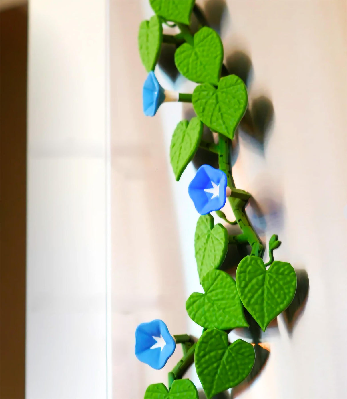 3D printed morning glory fridge magnets featuring blue flowers and green ivy leaves for customizable decor.